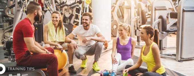 Friends in gym for training tips