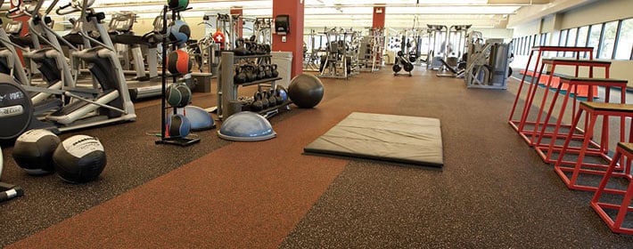 Inside of gym with rolled rubber flooring from Zogics.